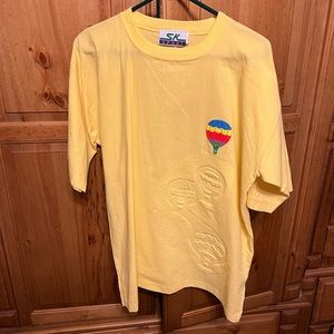 Womens very pretty air balloon scene on front of shirt , nice yellow color !